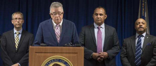 A press conference Thursday on the indictment involving Ayudando Guardians and its two top managers drew top law enforcement officials involved in the investigation. From left to right, Assistant U.S. Attorney Jeremy Pena, Acting U.S. Attorney James Tierney, IRS Special Agent Ismael Nevarez Jr., and FBI Assistant Special Agent in Charge Derek Fuller. (Roberto E. Rosales/Albuquerque Journal)